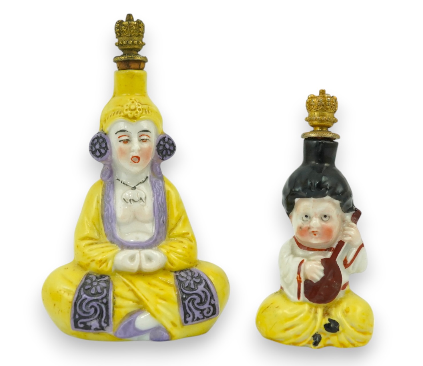 Two Continental porcelain figural scent bottles with gilt stoppers, largest 9cm high. Condition - good